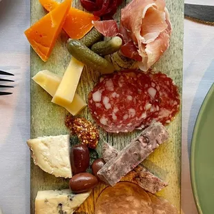 an assortment of meats and cheeses