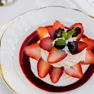a dessert with strawberries and blueberries