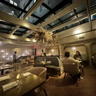 Second floor dining with a huge skylight.