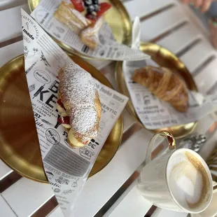 Strawberry danish, strawberry cream croissant, butter croissant &amp; cappuccino