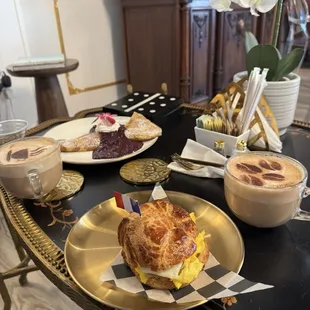 Sausage and egg croissant, Blueberry and ricotta crepes and cappuccinos.