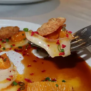 The Le Carpaccio de Saint Jacques was made with Scallops, Pearl Pepper, Tamarind Passion Fruit Ponzu &amp; Wonton.