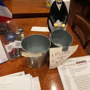 a man in a tuxedo sitting at a table