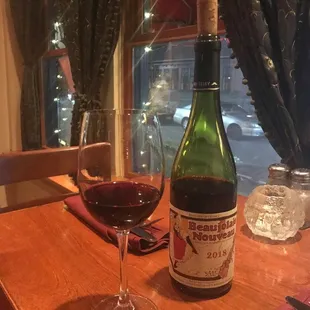 a glass of wine and a bottle of wine