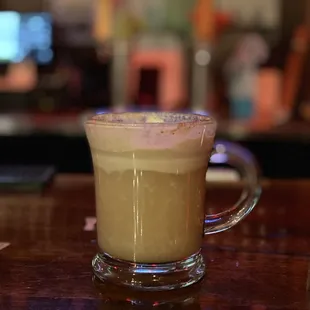 a cup of coffee on a bar