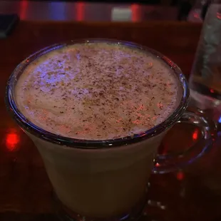 a cup of coffee on a table