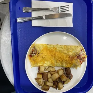 A custom Breakfast Create Your Own Omelette with cheese on top. Was filling and delicious.