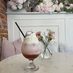 a table with a vase of flowers
