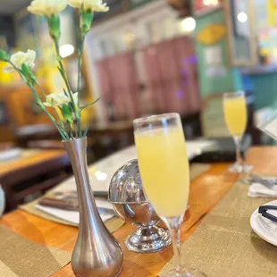 a glass of orange juice on a table