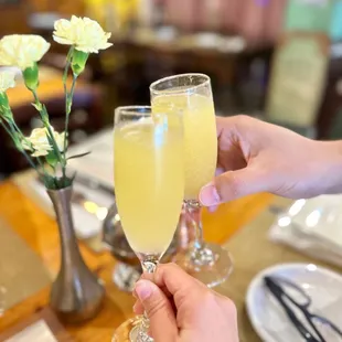 a person holding a glass of champagne