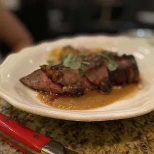 Hanger steak in tarragon cream sauce with root vegetable gratin