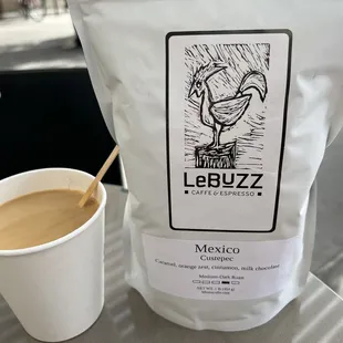 Bag of coffee beans and the free coffee they give you when you buy beans