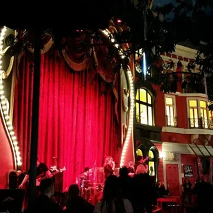 a crowd of people in front of a stage