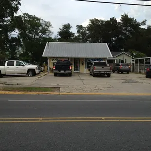 two trucks parked in front of a building