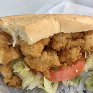 a closeup of a sandwich with lettuce and tomato