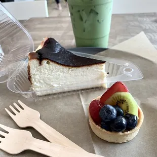 Iced matcha latte w/ almond milk, burnt basque cheesecake, &amp; fruit tart!