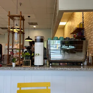 a counter with a yellow chair