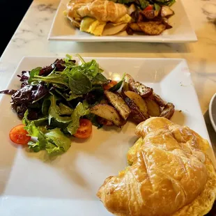 Breakfast croissant with a side salad &amp; potatoes