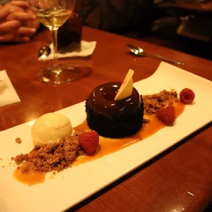 Nanaimo Cake! Chocolate cake with peanut butter creme, raspberry sauce, and coconut ice cream. So delicious!