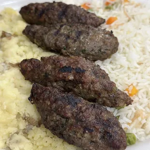 Beef kabob platter with rice and mashed potatoes