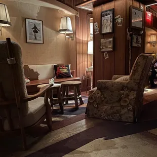 a man sitting in a chair in a living room