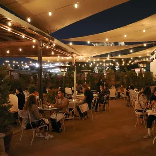 outdoor dining area with string lights