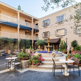 Outdoor Dining with tables and chairs in Le Chateau Garden Bistro in Costa Mesa.
