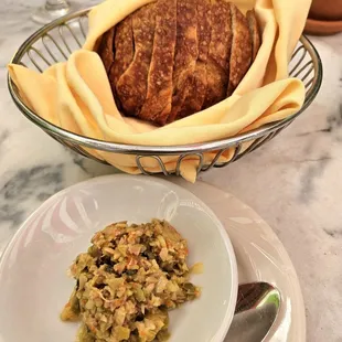Le Chateau: Bread service, warm sourdough with green olive tapenade, $7, recommended!