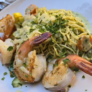 Pesto Cream Sauce and Parmesian angel hair pasta with grilled shrimp. Delicious!