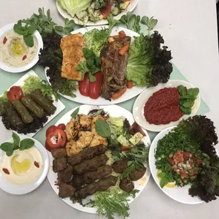 Combination of broil kababs and hummus- baba Ghannouj salad - Mauhamara- tabouleh