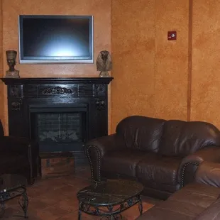 a living room with leather furniture