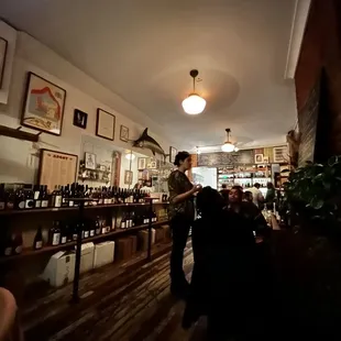 a man standing at a bar