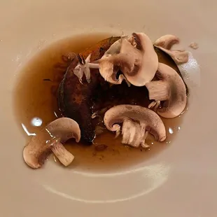 a plate of food with mushrooms