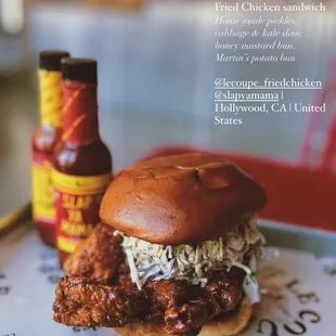 Fried Chicken sandwich - House made pickles, cabbage &amp; kale slaw, honey mustard bun, Martin&apos;s potato bun, slap ya mama sauce