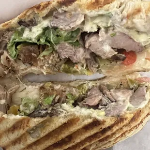 Grilled  Campagnolo-  Grilled chicken breast, roasted red peppers, provolone cheese, focaccia sauce and baby lettuce.
