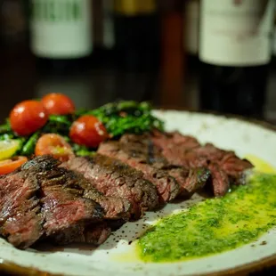 a plate of steak and vegetables