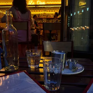a woman sitting at a table in a restaurant