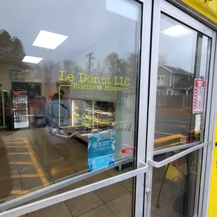 the reflection of a store front window