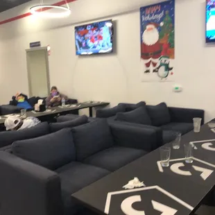 Some of the indoor seating and Tv&apos;s