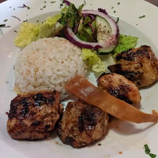 Grilled shish tawuk with rice and salad.