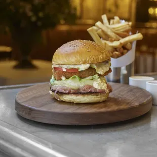 a burger and french fries on a table