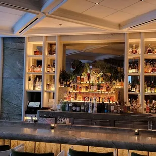 a bar with a lot of bottles