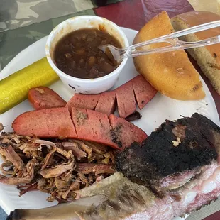 Brisket, ribs, hot links, baked beans, pickle, bun, spicy bbq