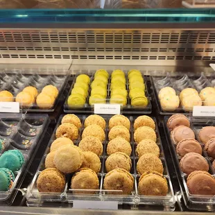 a variety of pastries in a display case