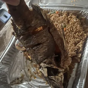 Overcooked fish with missing pieces