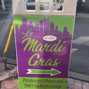 a sign on the sidewalk