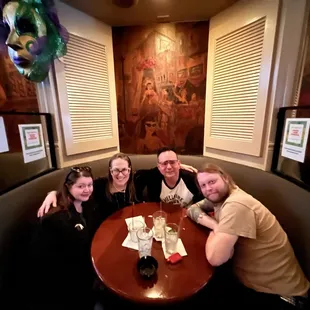 a group of people sitting at a table