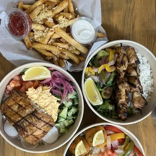 We got garlic fries, Grilled Salmon Bowl, Grilled Chicken Skewer Bowl and 3 Piece Lentil Ball Bowl