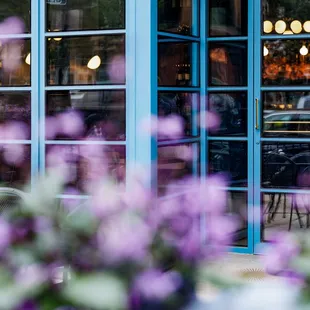 Le Midi storefront and lavender flower boxes on the patio