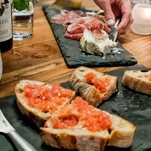 A selection of small bites: Pan con Tomate, Charcuterie, and Fromage